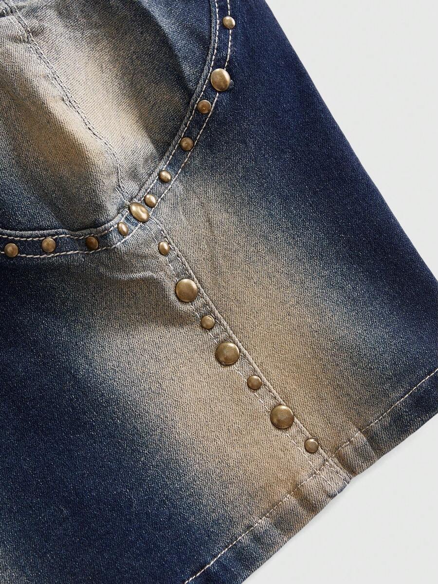 Women's medium wash denim camisole crop top featuring spaghetti straps, cup detailing, and rivet accents.
