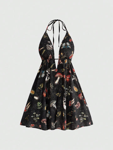 Black fairycore halter backless mini dress with mushroom, moth, and plant print featuring a high waist and flared hem.