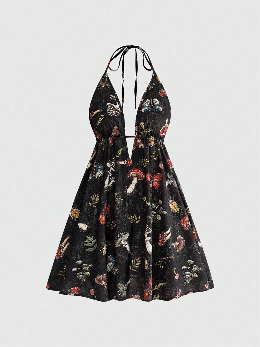 Black fairycore halter backless mini dress with mushroom, moth, and plant print featuring a high waist and flared hem.