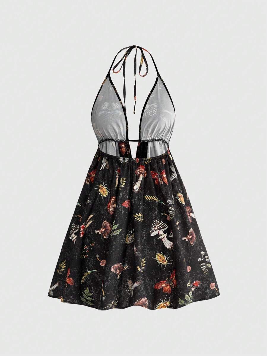 Black fairycore halter backless mini dress with mushroom, moth, and plant print featuring a high waist and flared hem.