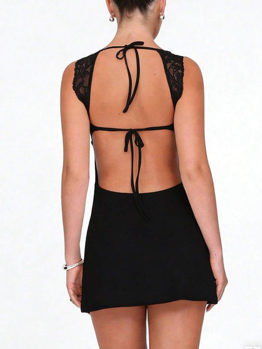 Women's sleeveless white lace-trimmed bustier mini dress featuring backless tie-up detail and slim fit A-line silhouette.