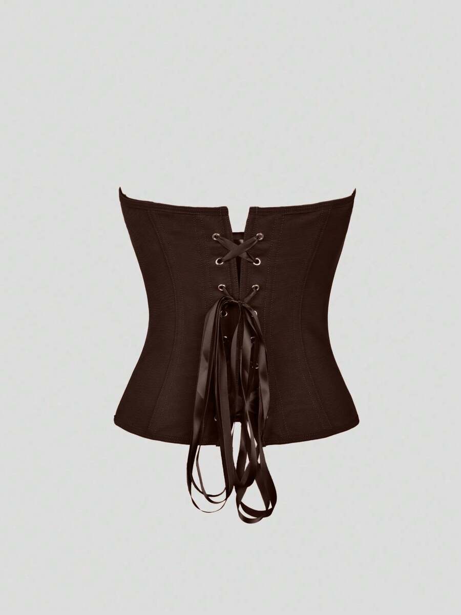 Black strapless corset top with boning, lace-up back, and a cropped slim-fit silhouette for women.