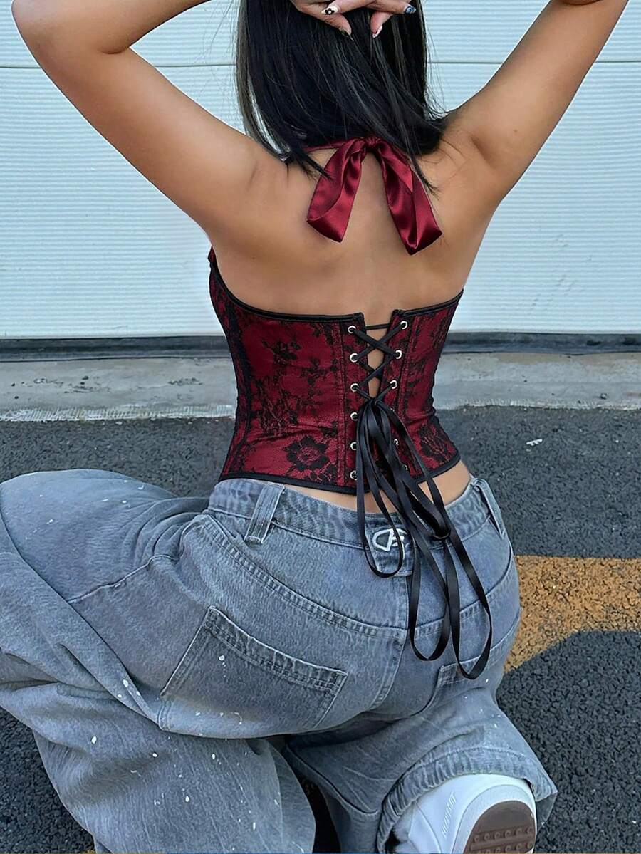 White satin corset crop top featuring a halter neck, slim fit, and back lace-up design.