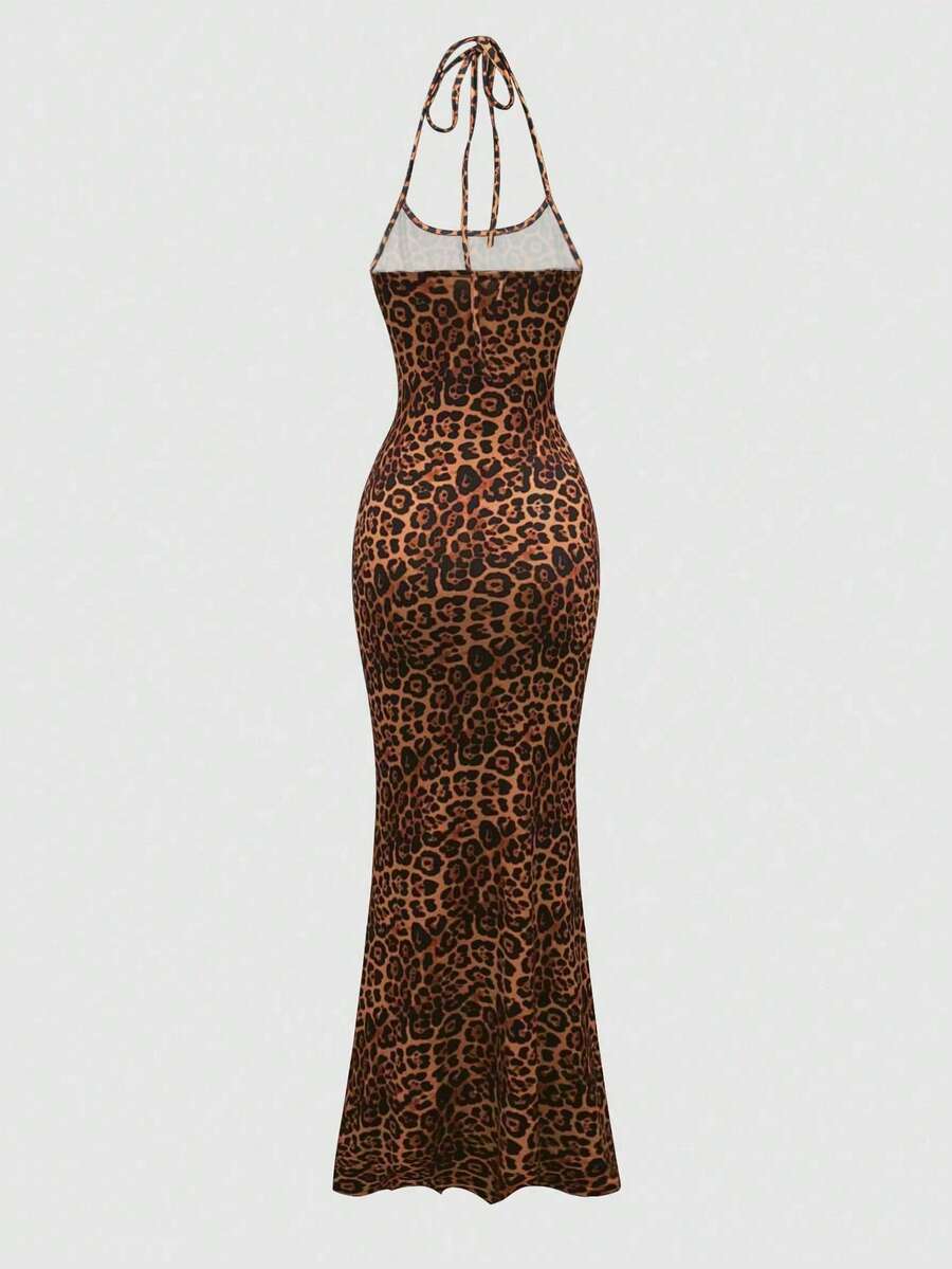 Women wearing a sleeveless leopard print halter neck maxi bodycon dress with a side slit