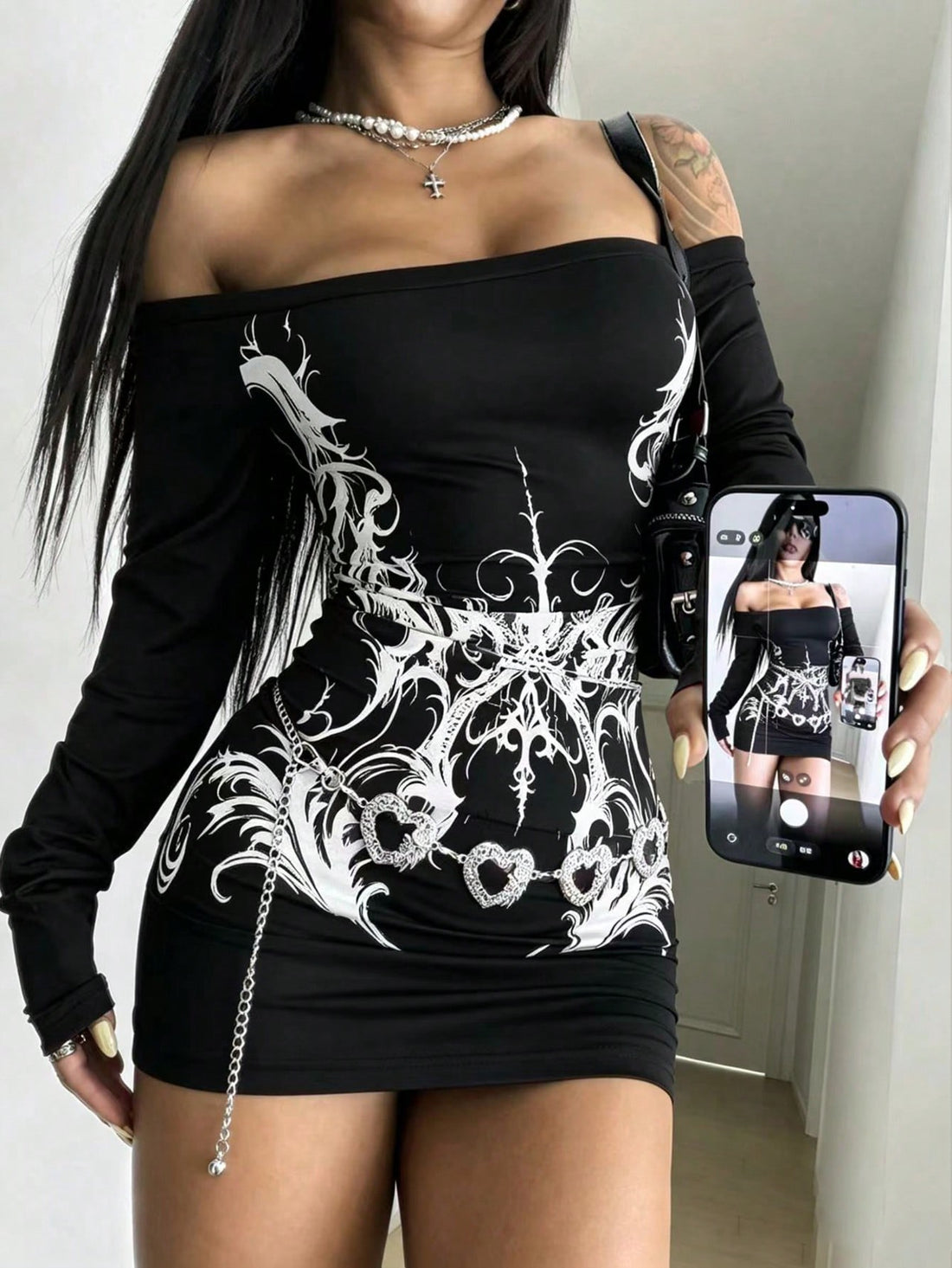 Black off-shoulder long sleeve bodycon mini dress for women made of knitted fabric featuring a slim fit backless pencil hem silhouette.