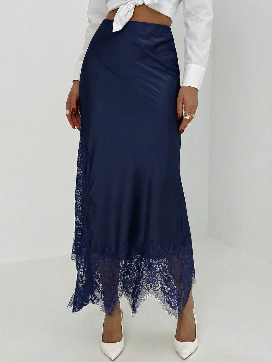Women's elegant black lace patchwork mermaid maxi skirt featuring asymmetrical contrast lace design and low waist fit.