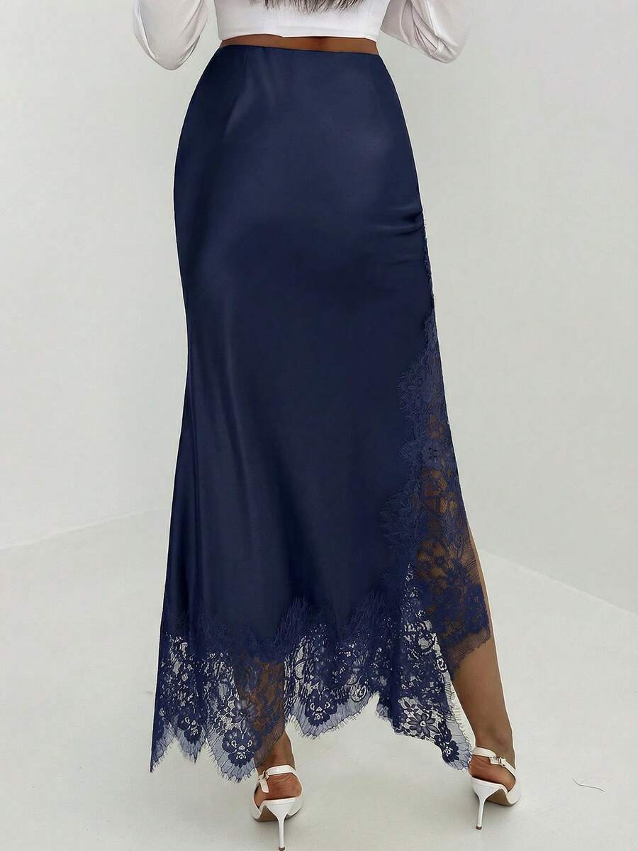 Women's elegant black lace patchwork mermaid maxi skirt featuring asymmetrical contrast lace design and low waist fit.