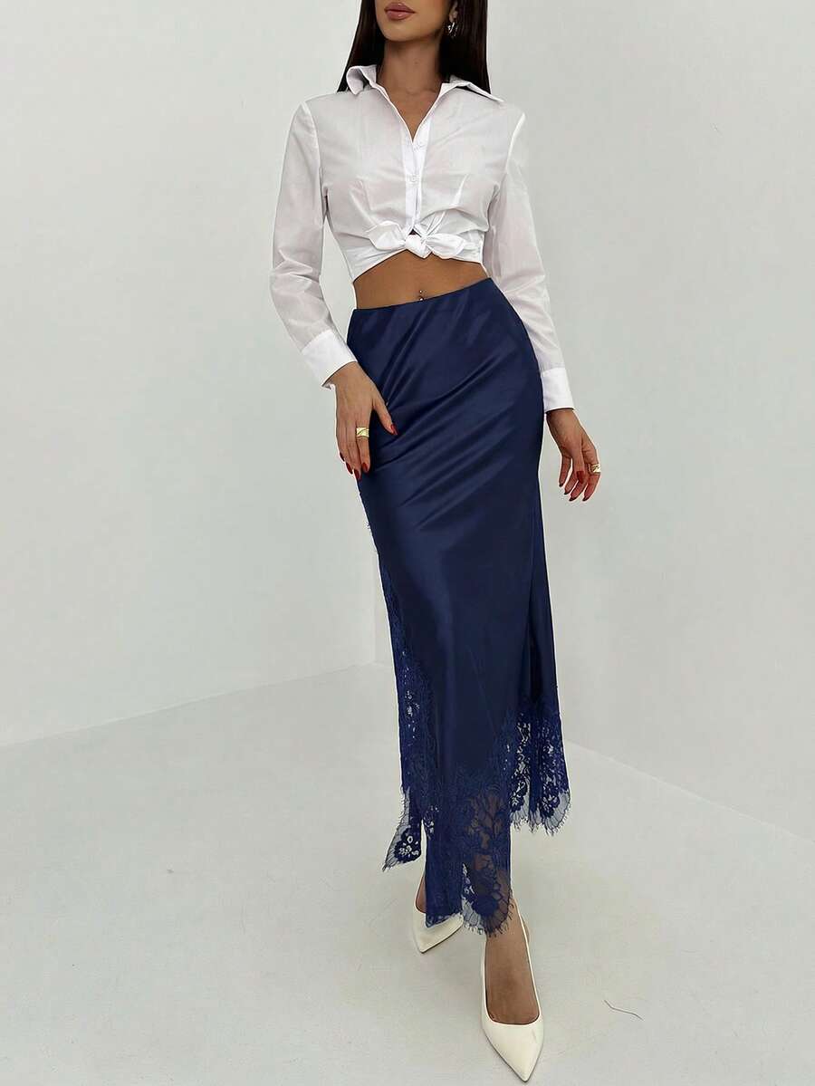 Women's elegant black lace patchwork mermaid maxi skirt featuring asymmetrical contrast lace design and low waist fit.
