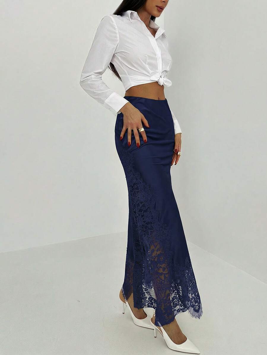 Women's elegant black lace patchwork mermaid maxi skirt featuring asymmetrical contrast lace design and low waist fit.