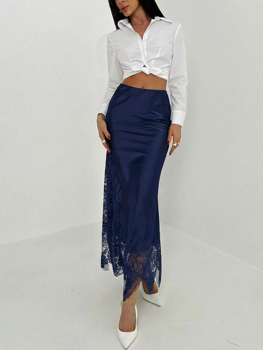Women's elegant black lace patchwork mermaid maxi skirt featuring asymmetrical contrast lace design and low waist fit.