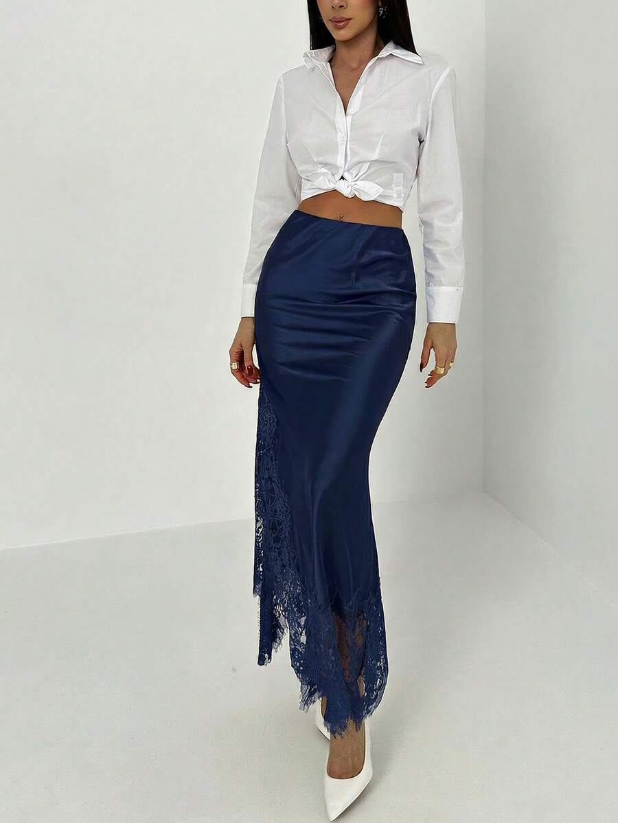 Women's elegant black lace patchwork mermaid maxi skirt featuring asymmetrical contrast lace design and low waist fit.