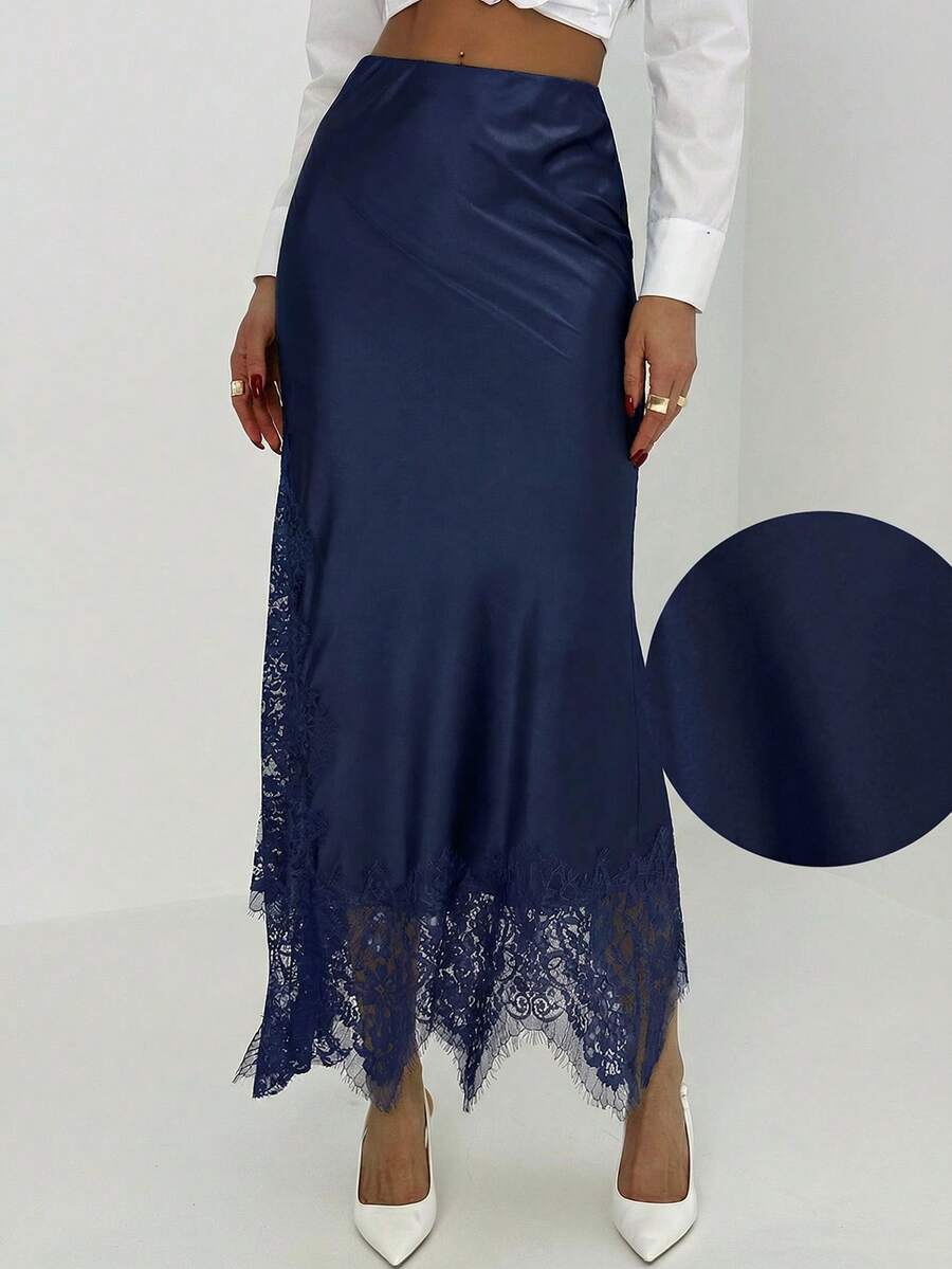 Women's elegant black lace patchwork mermaid maxi skirt featuring asymmetrical contrast lace design and low waist fit.