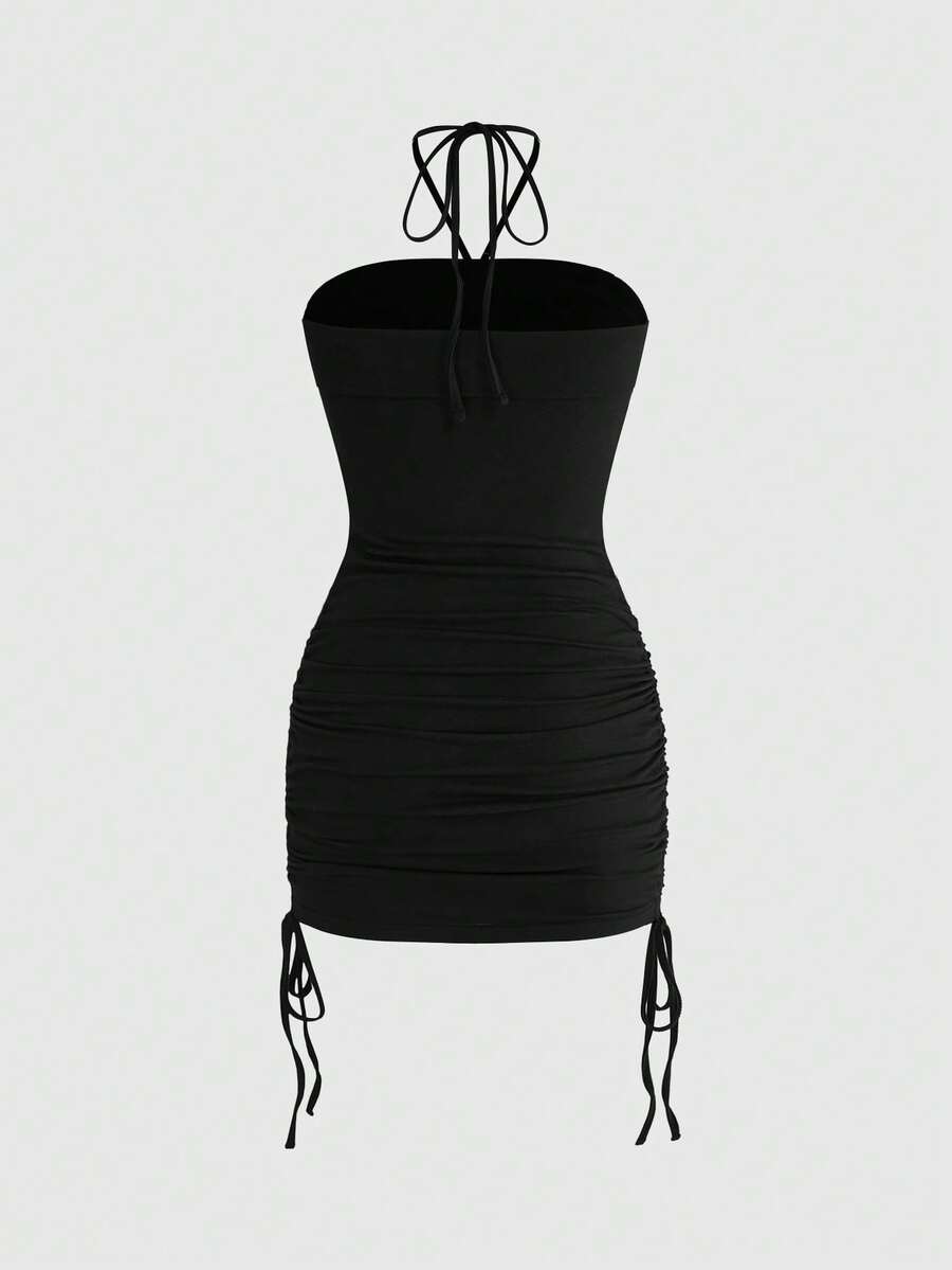 Women's black halter bodycon mini dress featuring ruched details, a sleeveless cut, and slim fit silhouette made from knitted fabric.