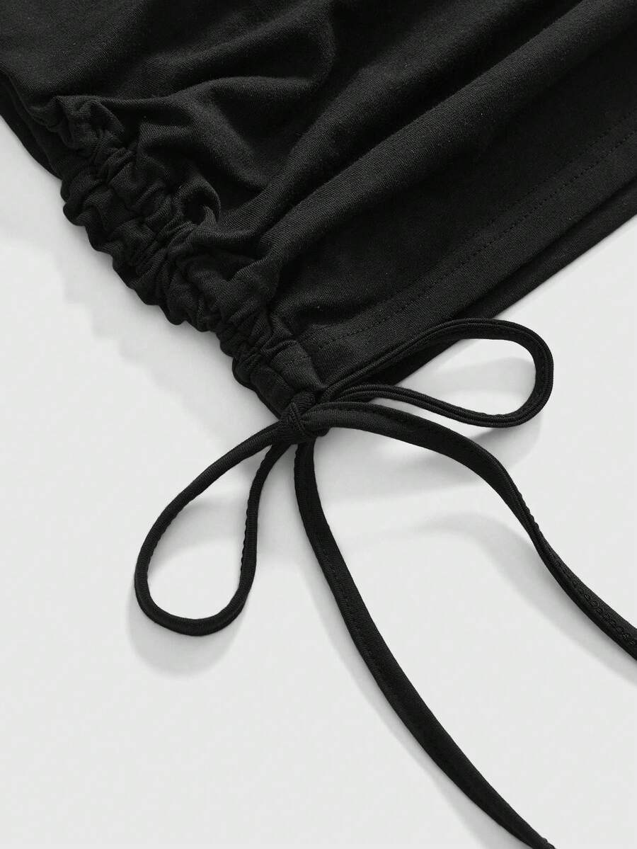Women's black halter bodycon mini dress featuring ruched details, a sleeveless cut, and slim fit silhouette made from knitted fabric.