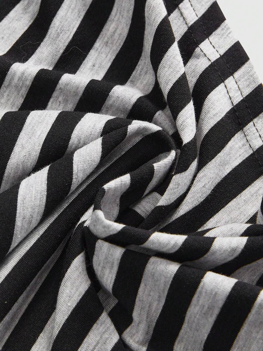 Women's striped halter bodycon mini dress featuring a sleeveless Y2K cami style in knitted high-stretch fabric with ring details.