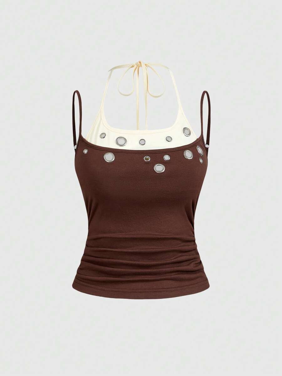 Black halter crop tank top for women featuring lace up front details, ruched accents, and appliques in a slim fit knitted fabric.