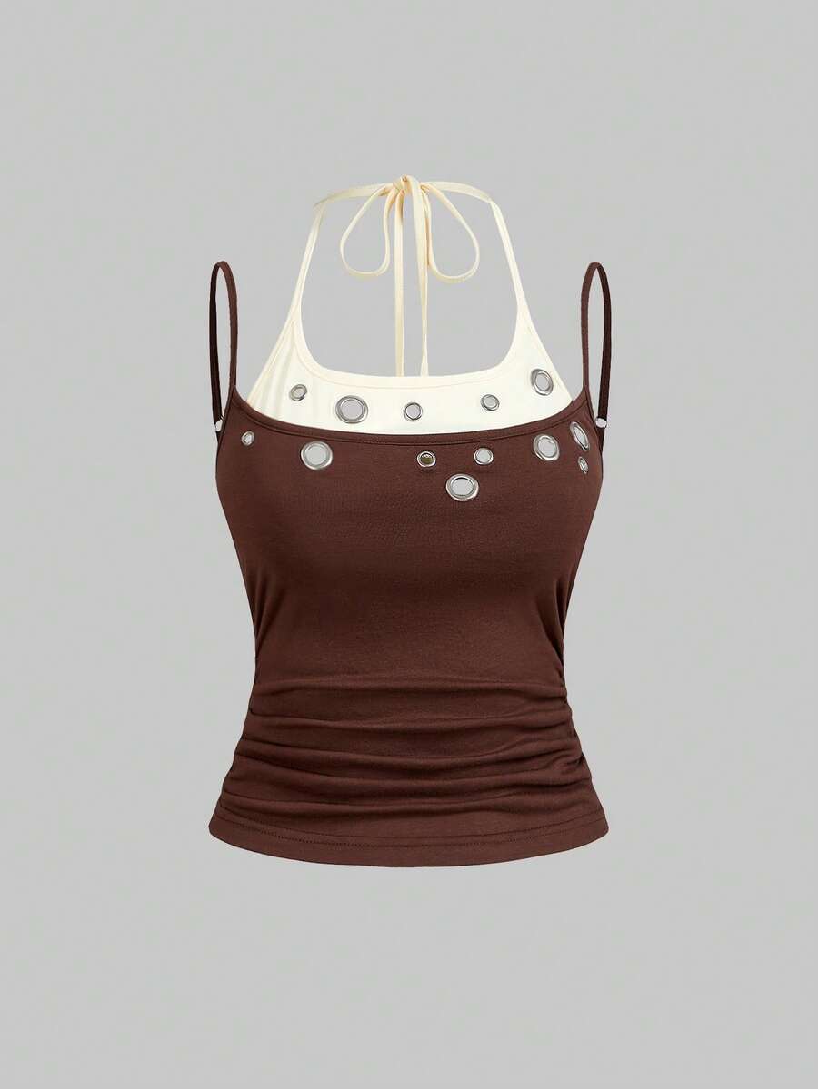 Black halter crop tank top for women featuring lace up front details, ruched accents, and appliques in a slim fit knitted fabric.