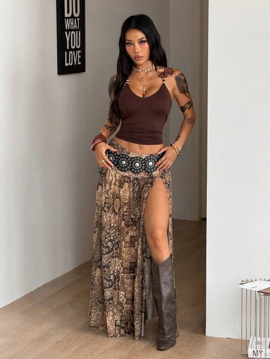Women's blue and brown graphic print long flared skirt with low waist, split thigh detail, and textured semi-sheer fabric.
