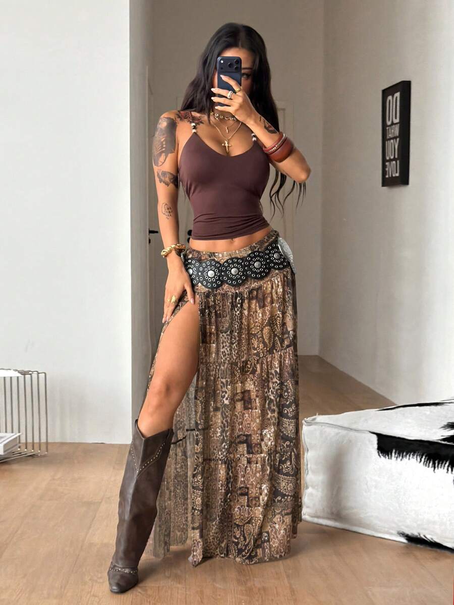 Women's blue and brown graphic print long flared skirt with low waist, split thigh detail, and textured semi-sheer fabric.