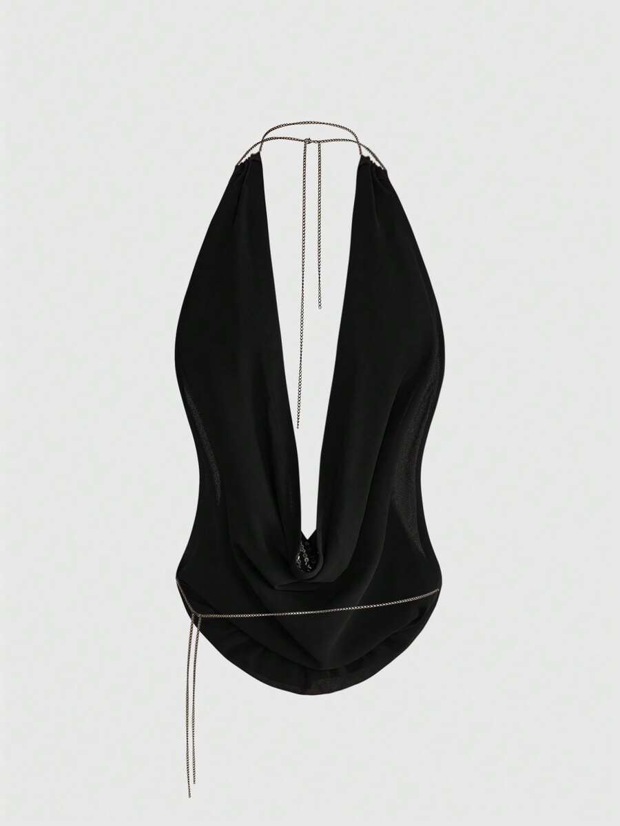 Women wearing a black Y2K draped halter neck backless sequin crop top crafted from semi-sheer chiffon fabric.