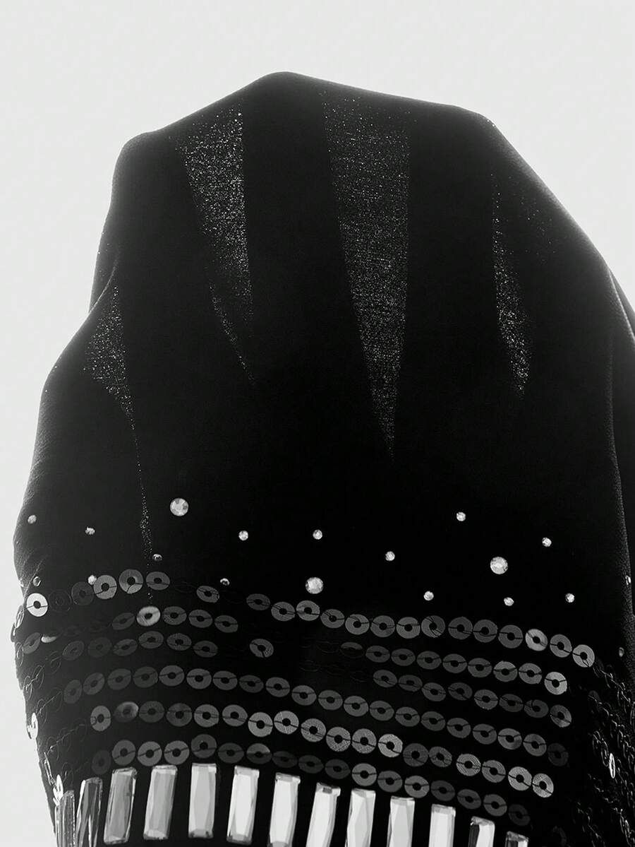 Women wearing a black Y2K draped halter neck backless sequin crop top crafted from semi-sheer chiffon fabric.