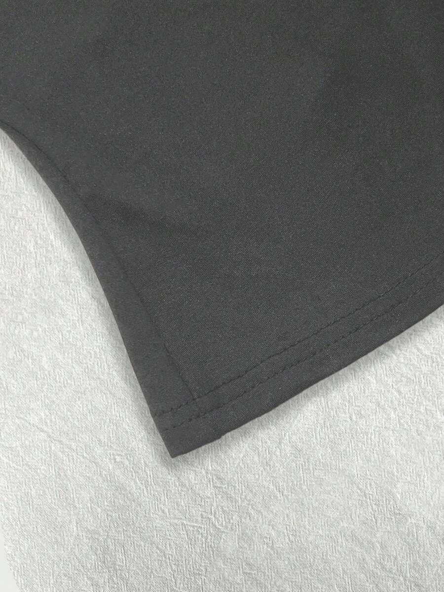 A women's solid slim fit camisole top with delicate contrast lace trim around the neckline and spaghetti straps.