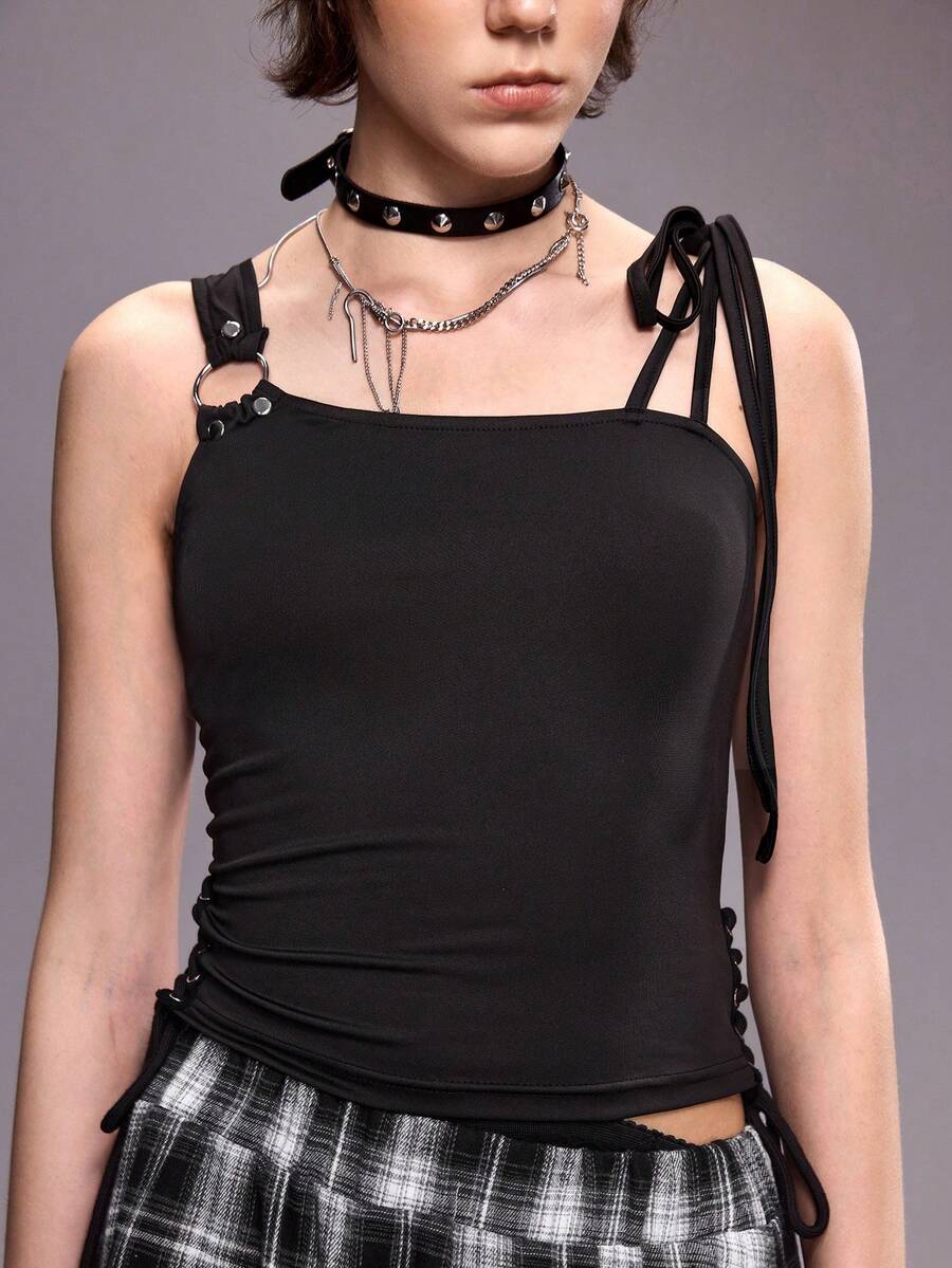 Women's black asymmetrical shoulder tie cami top with metallic ring detail and slim fit design.