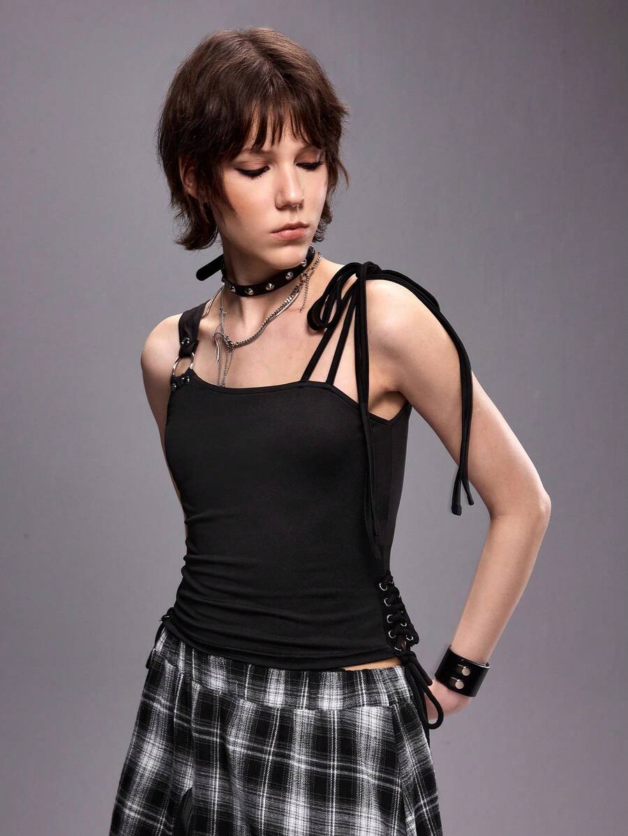 Women's black asymmetrical shoulder tie cami top with metallic ring detail and slim fit design.