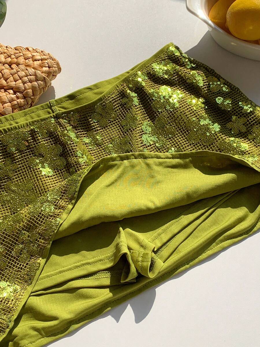 Women's white 100% cotton low waist mini skirt featuring a tropical print and zipper detail.