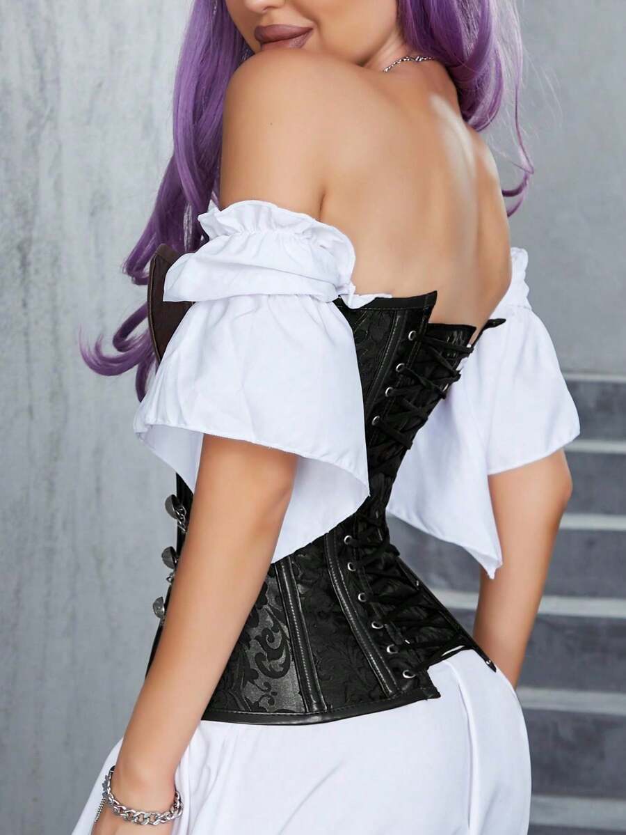 Women's black jacquard bustier tube top with chain detail, boned structure, and a slim fitted silhouette.