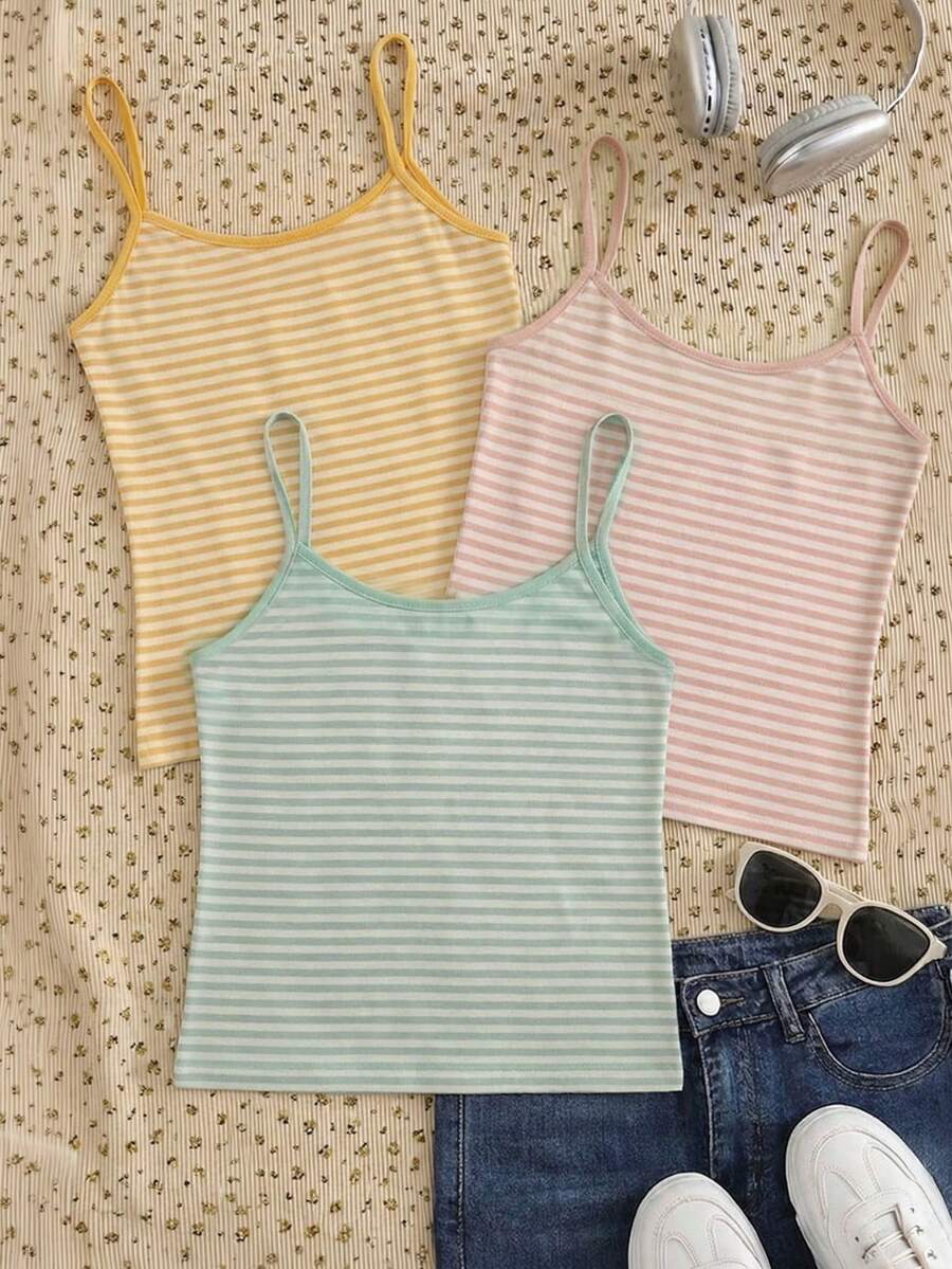 Women's pink striped crop camisole featuring criss cross spaghetti straps and slim fit design.