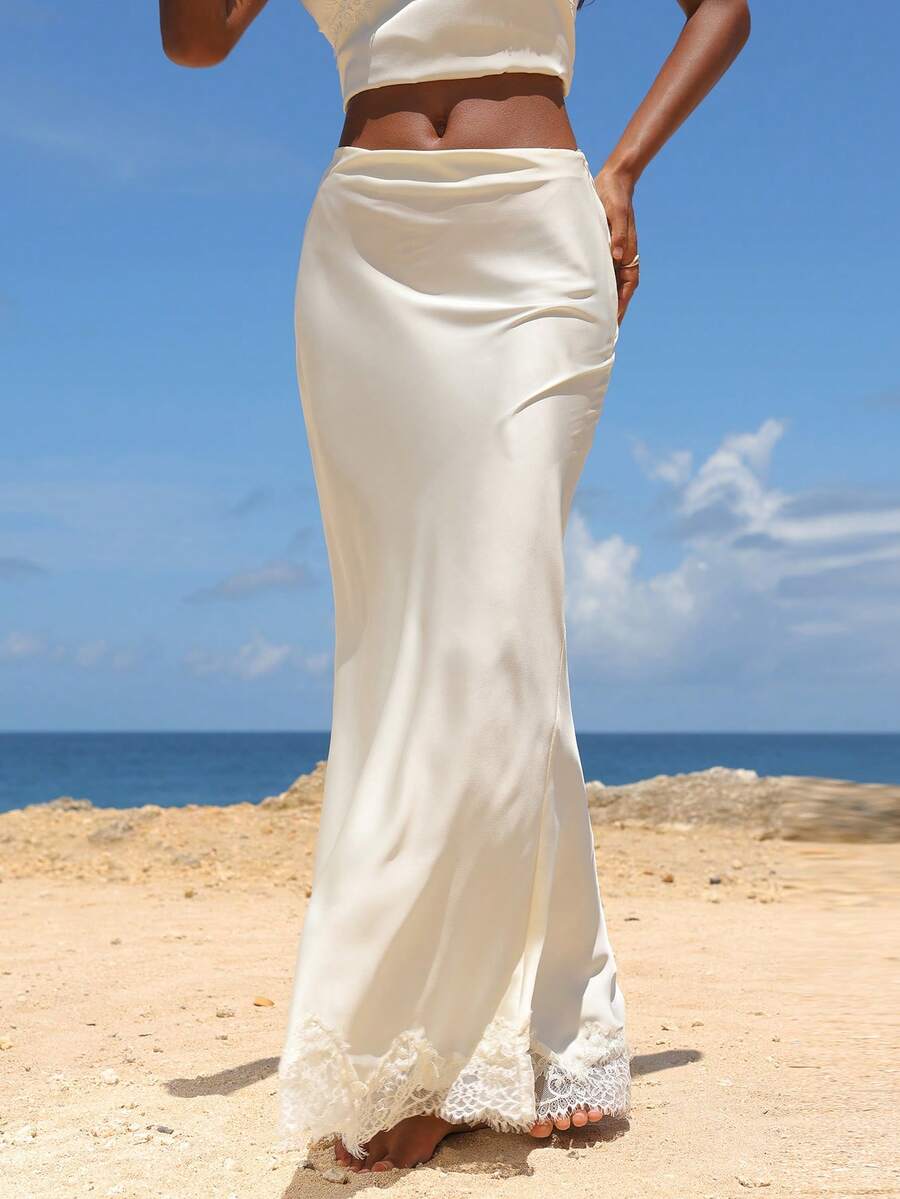 Women's black woven mermaid maxi skirt featuring a solid color design, mid waist, and 100% cotton fabric.