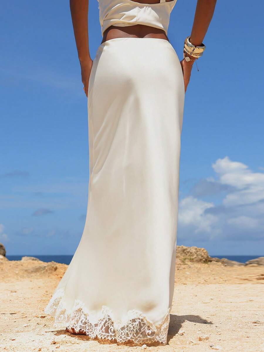 Women's black woven mermaid maxi skirt featuring a solid color design, mid waist, and 100% cotton fabric.