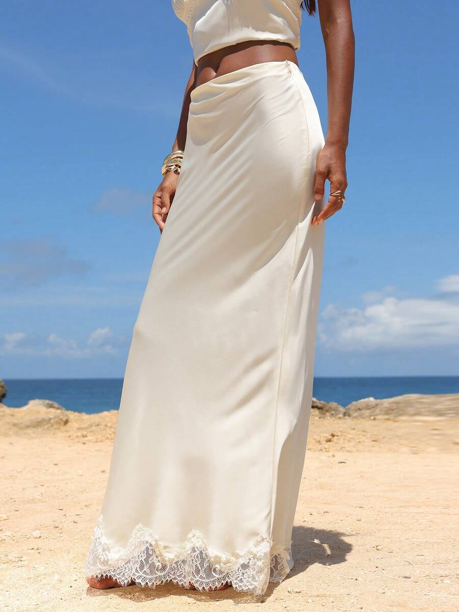 Women's black woven mermaid maxi skirt featuring a solid color design, mid waist, and 100% cotton fabric.