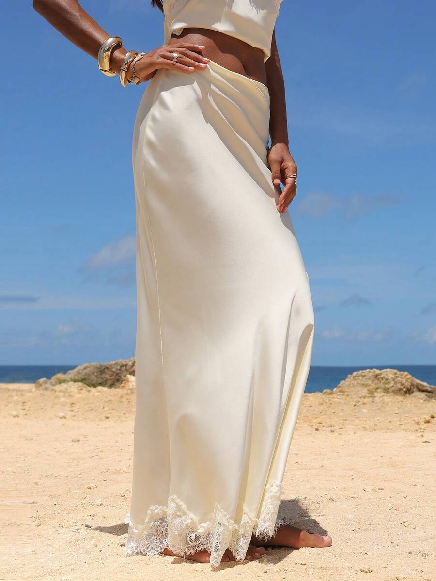 Women's black woven mermaid maxi skirt featuring a solid color design, mid waist, and 100% cotton fabric.