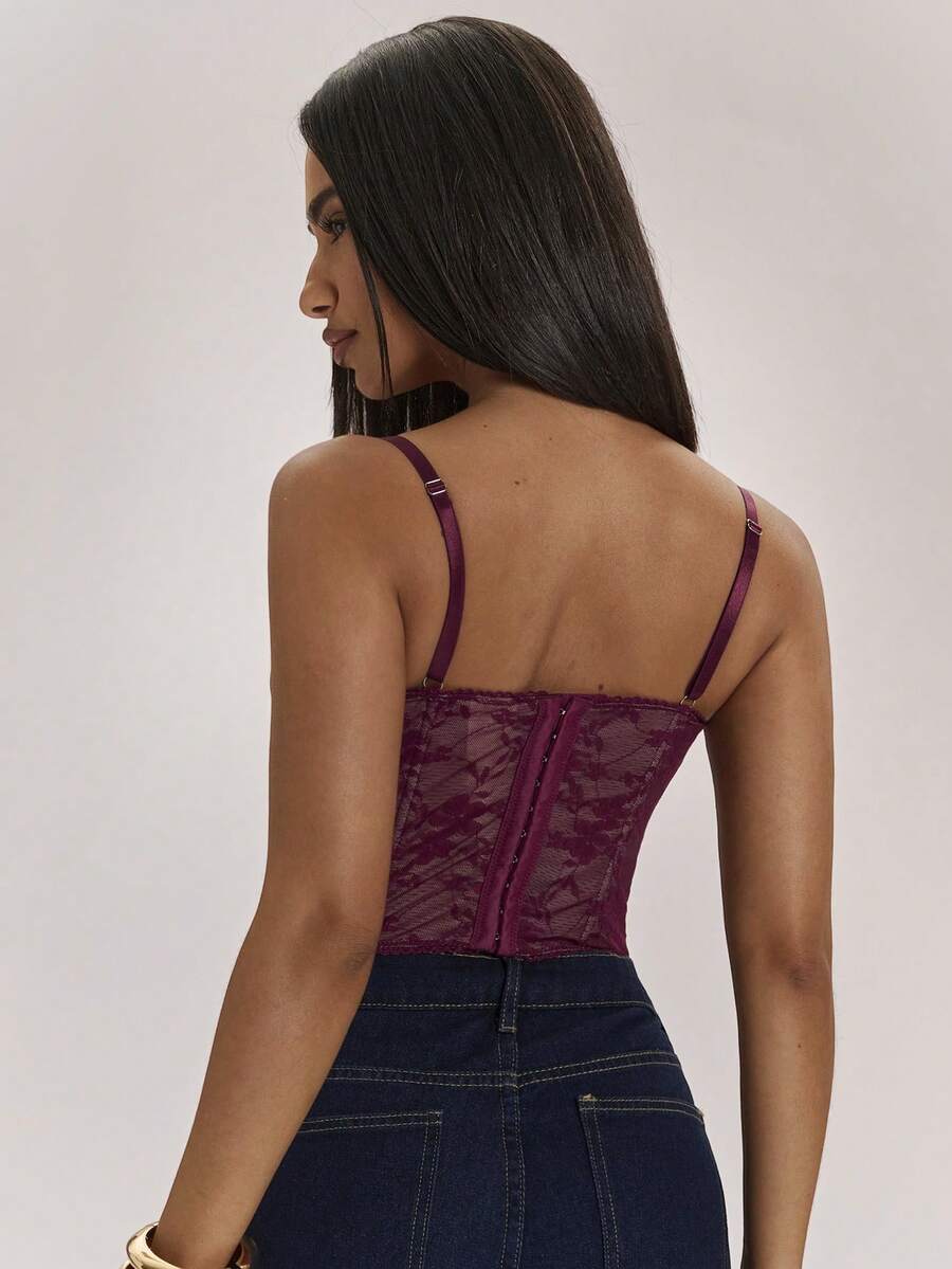 Women’s camisole top with cup detail, spaghetti straps, lined body, and slim fit design in knitted fabric with an asymmetrical hem.