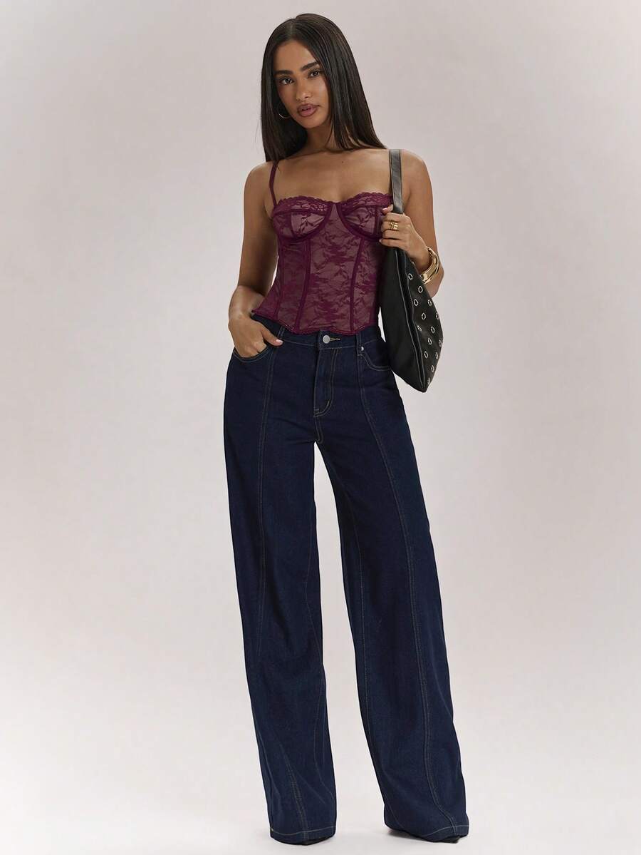 Women’s camisole top with cup detail, spaghetti straps, lined body, and slim fit design in knitted fabric with an asymmetrical hem.