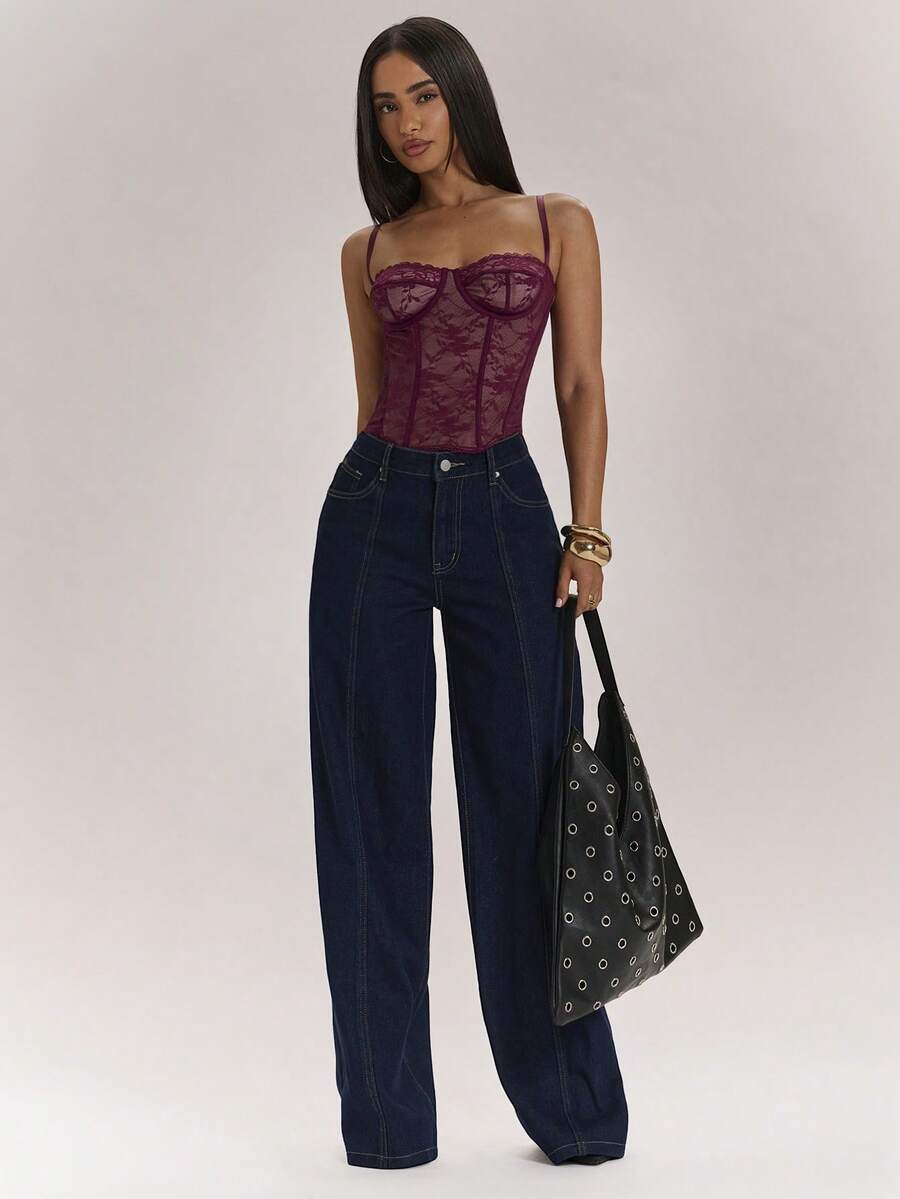 Women’s camisole top with cup detail, spaghetti straps, lined body, and slim fit design in knitted fabric with an asymmetrical hem.