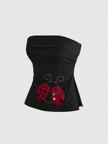 Women's black cropped strapless camisole top with ladybug embroidery and rhinestone details.