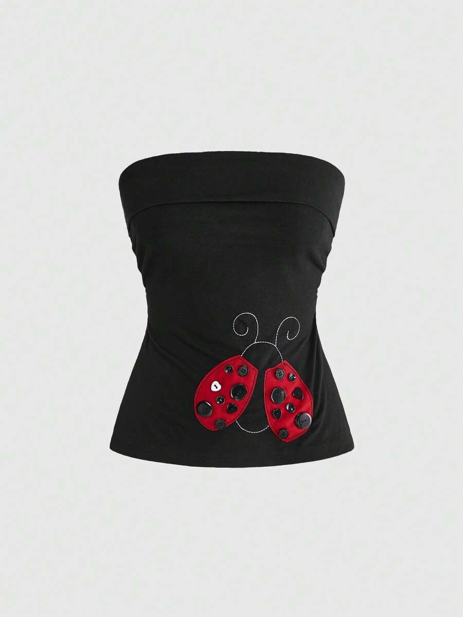 Women's black cropped strapless camisole top with ladybug embroidery and rhinestone details.