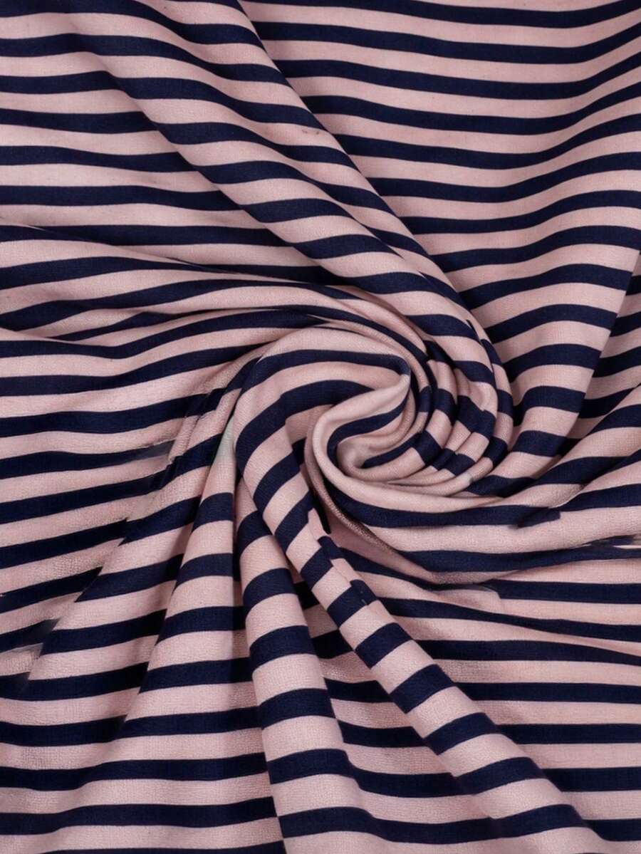 Women's pink striped crop camisole featuring criss cross spaghetti straps and slim fit design.