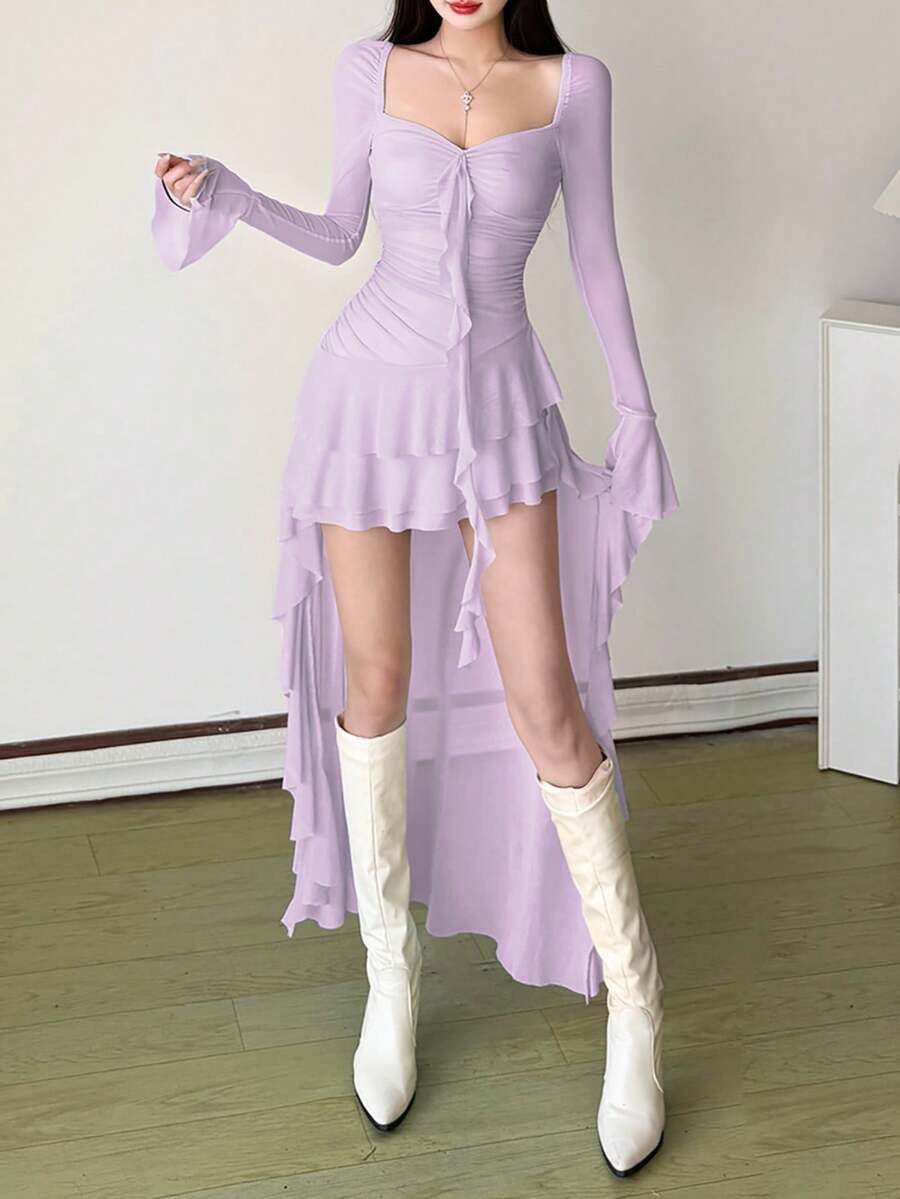 Woman wearing a solid off-the-shoulder asymmetrical midi dress with long flare sleeves.