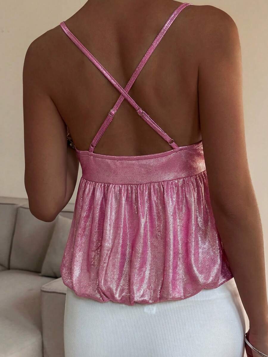 Burgundy sequin spaghetti strap cami top featuring a backless design and flared ruffle hem.
