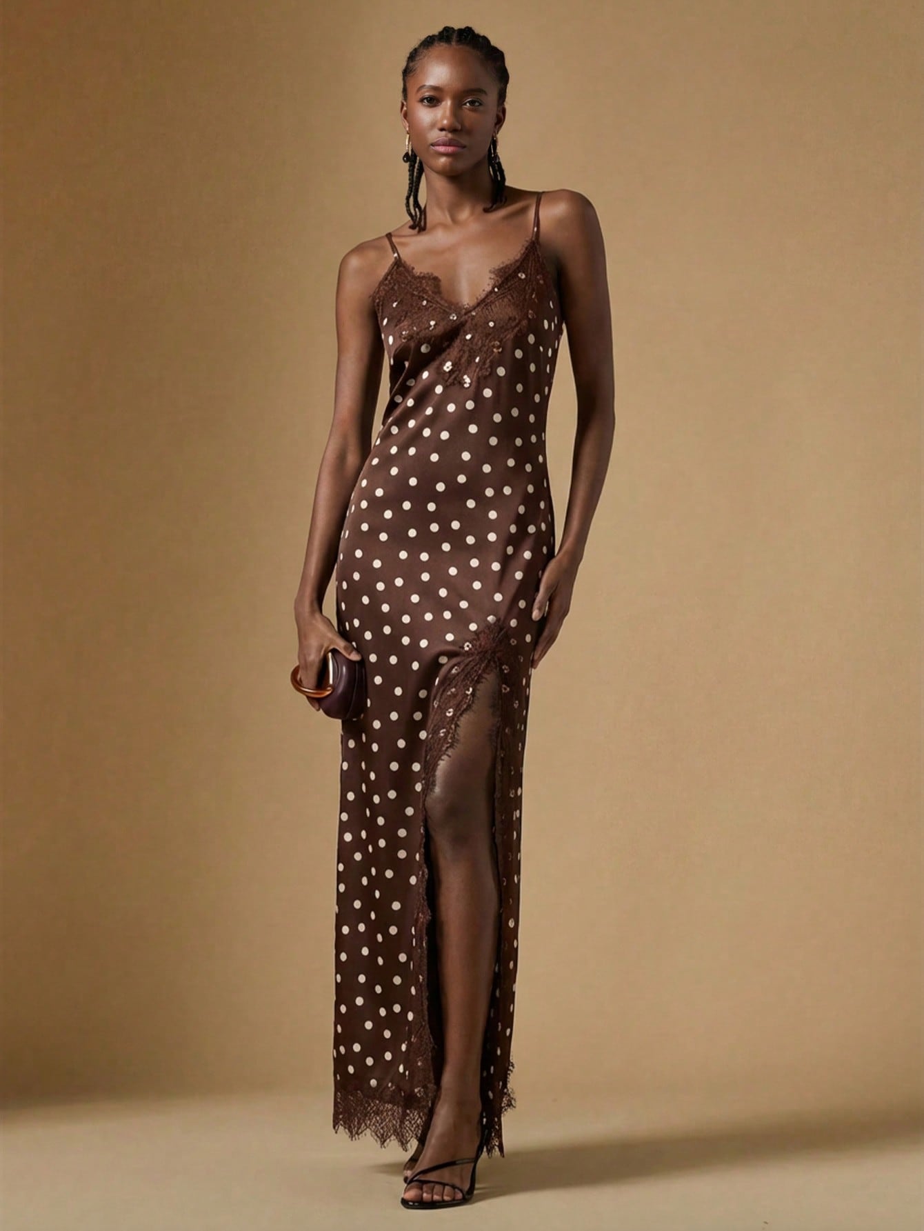 Women's black lace split satin long dress featuring spaghetti straps, asymmetrical slit hem, and matching arm sleeves.