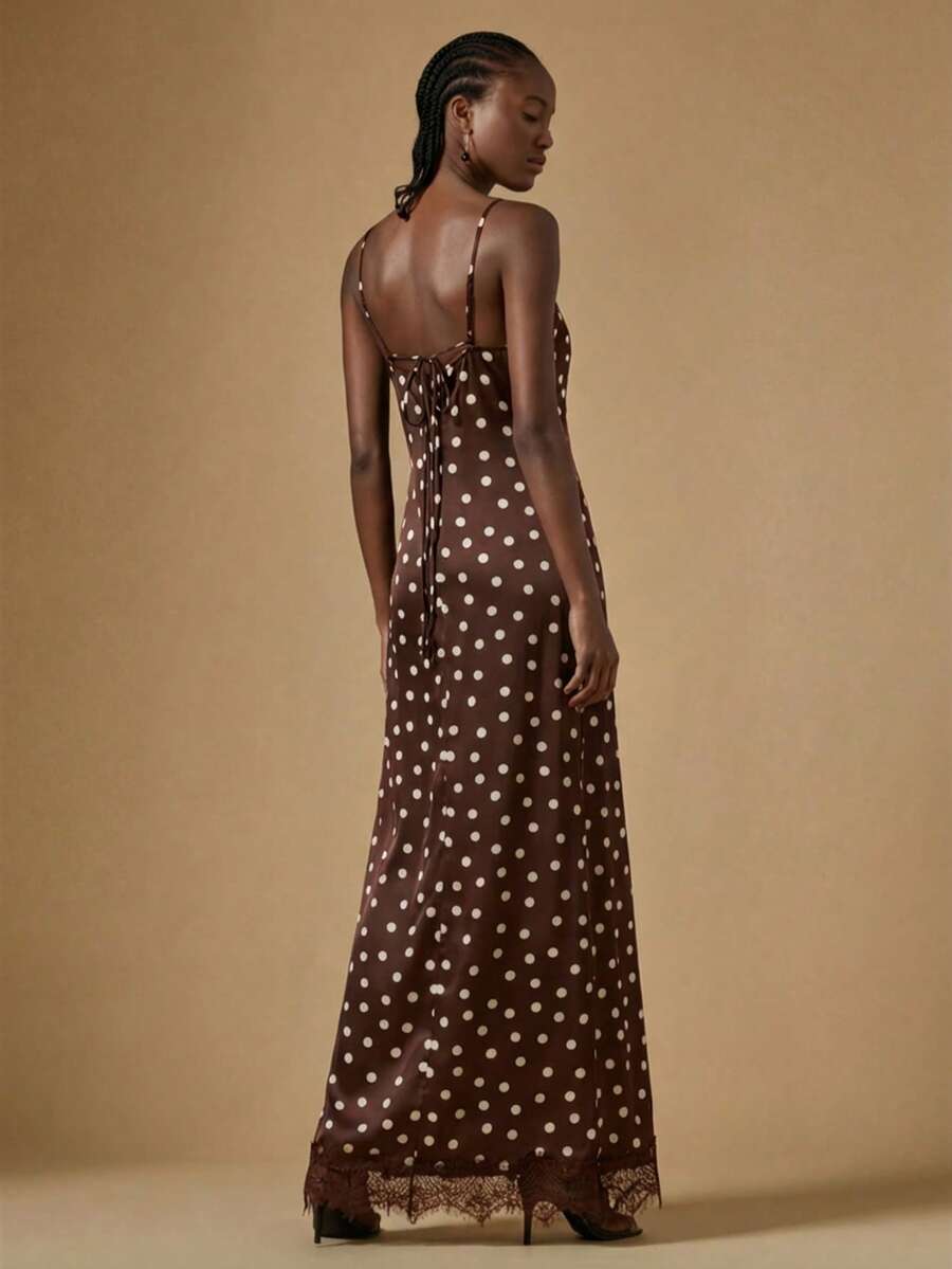 Women's black lace split satin long dress featuring spaghetti straps, asymmetrical slit hem, and matching arm sleeves.