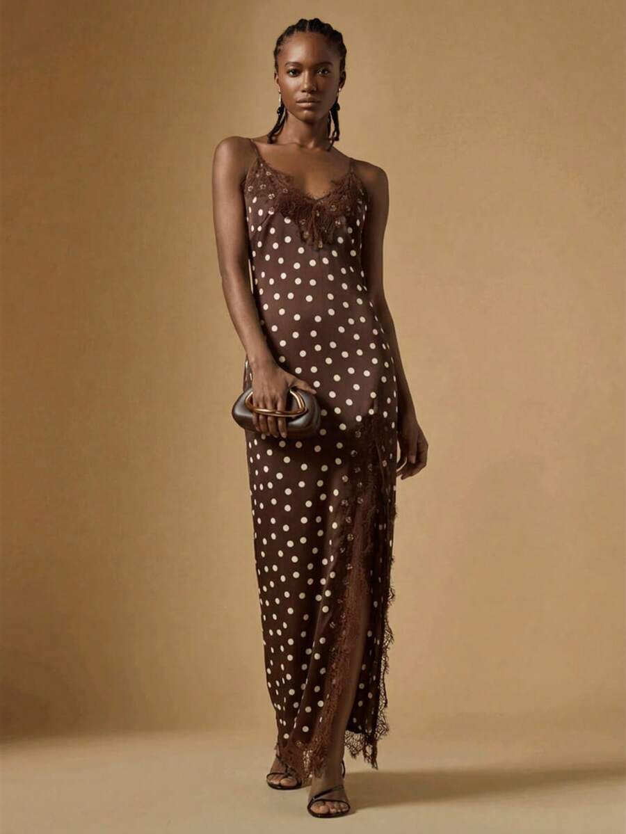 Women's black lace split satin long dress featuring spaghetti straps, asymmetrical slit hem, and matching arm sleeves.