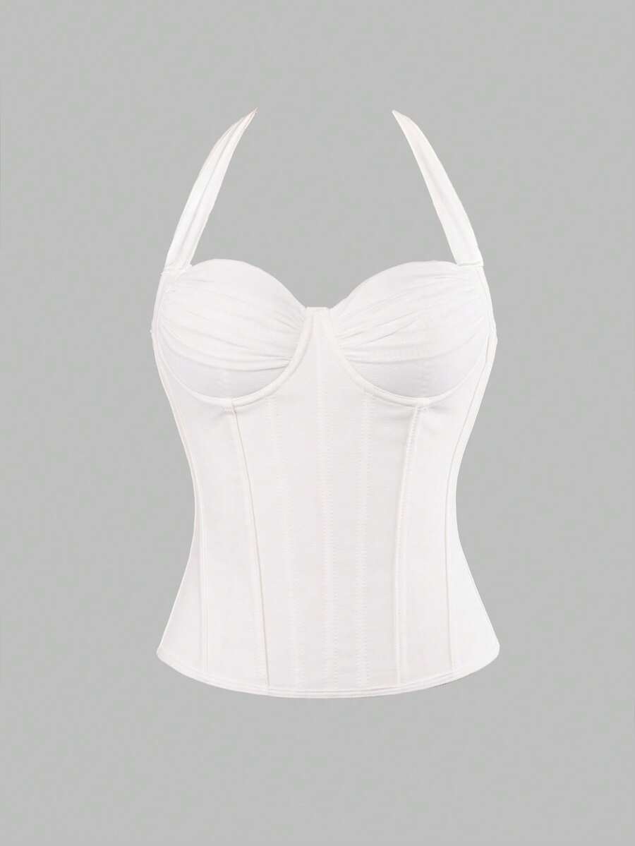 Women's white Y2K style corset cami top featuring a halter neckline, ruched detailing, asymmetrical hem, and backless lace-up design.