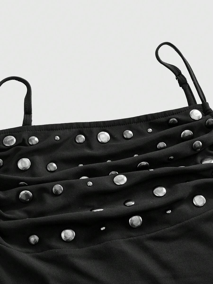 Black semi-sheer goth bodycon mini dress featuring spaghetti straps, studded details, flounce hem, and mesh fabric.
