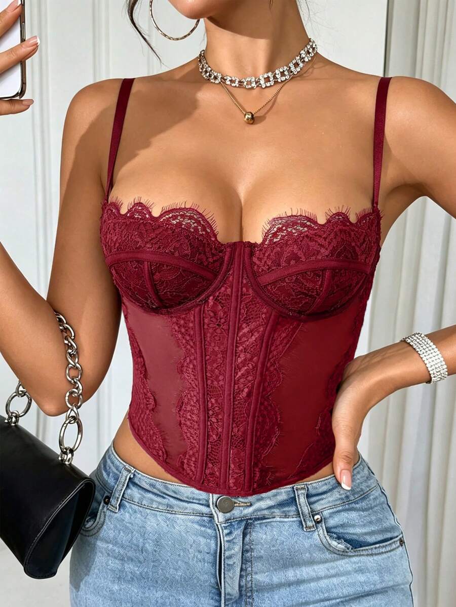 Women's black lace crop camisole featuring a deep V-neckline, slim fit silhouette, and matching arm sleeves.