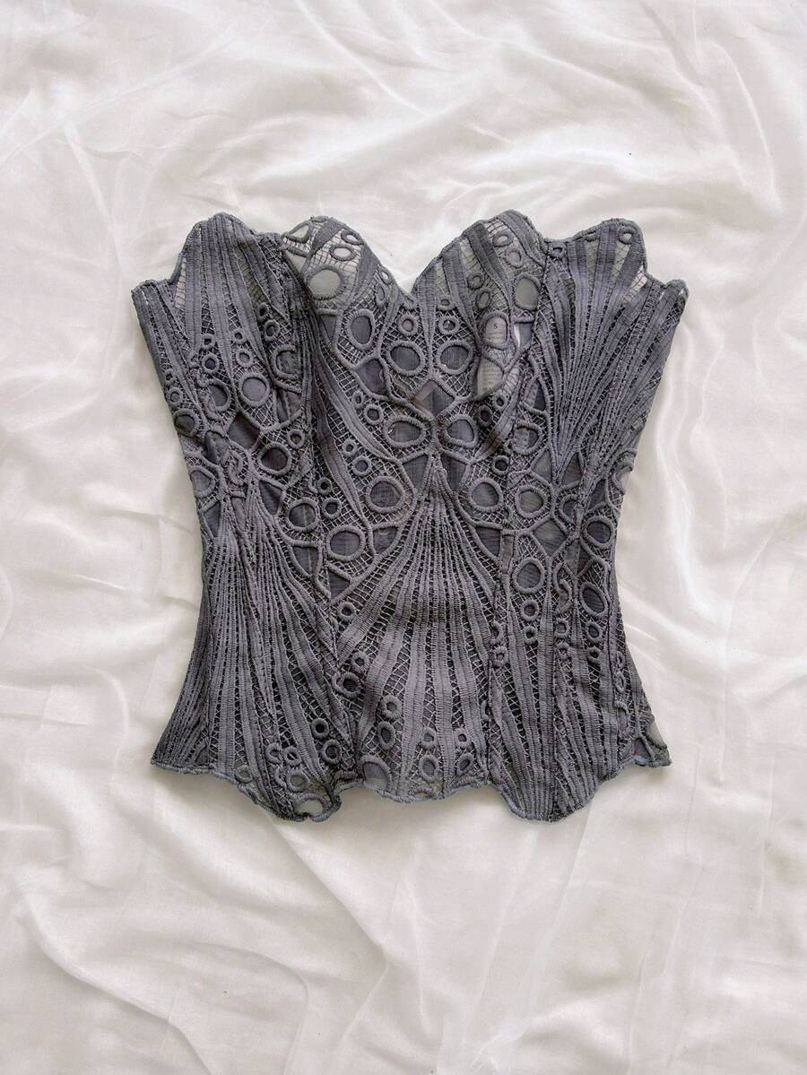 Women’s strapless corset bustier top with lace-up detail, asymmetrical embroidery, semi-sheer finish, and slim fit.